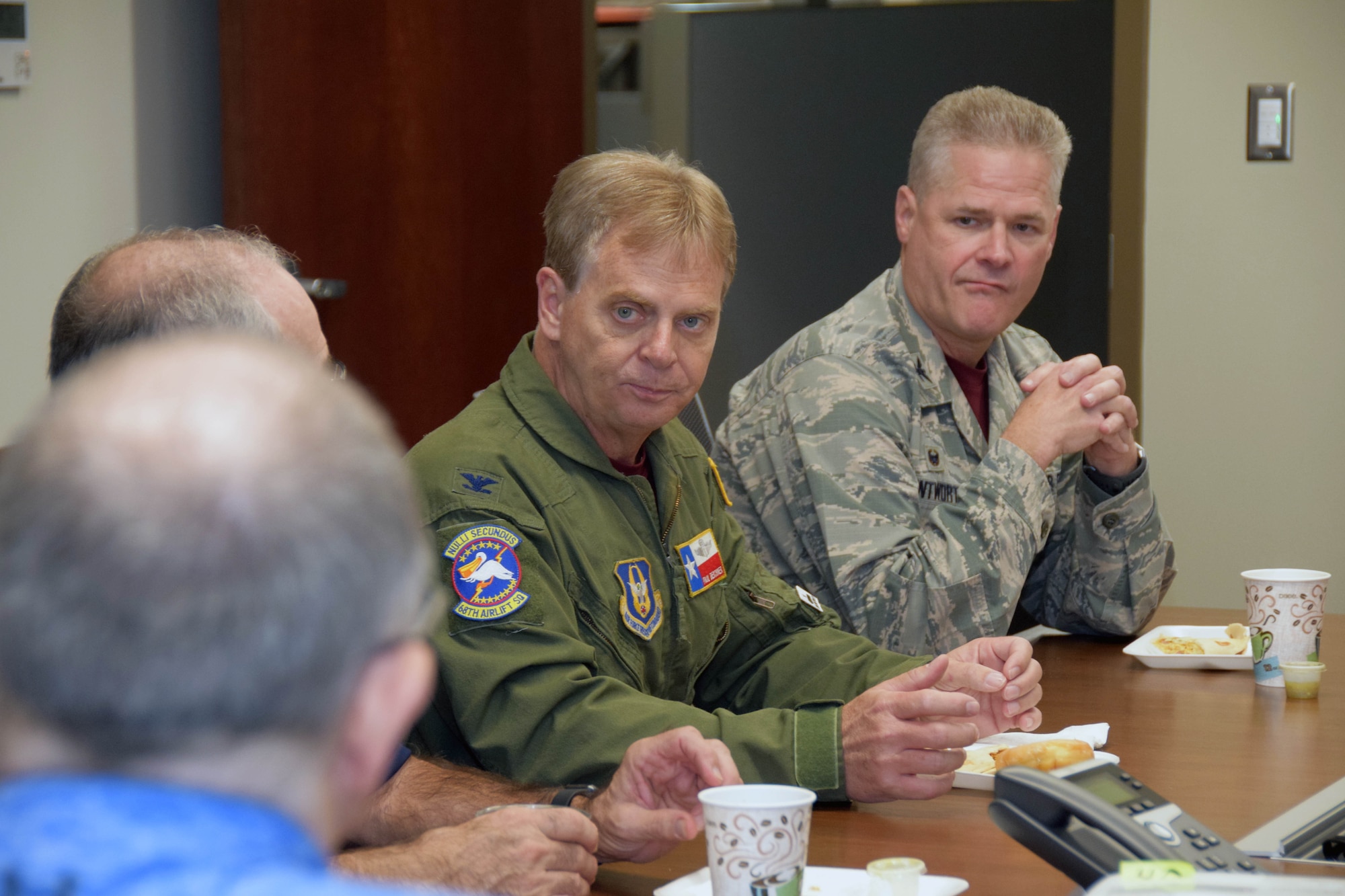 Cols. Paul Deschner, 433rd Aerospace Medicine Squadron, and Gregg Wentworth, 433rd Aeromedical Staging Squadron, listen to a discussion with honorary commanders during a tour of the 433rd Medical Group Oct. 5, 2019 at Joint Base San Antonio-Lackland, Texas.