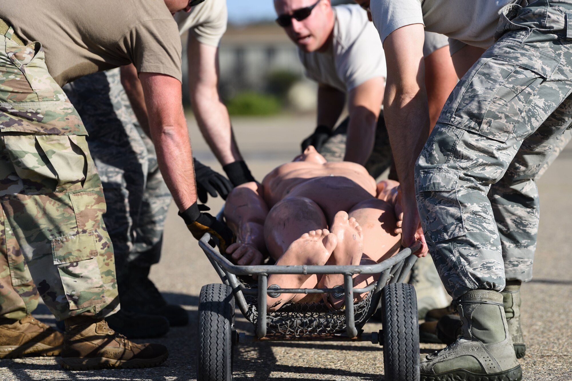 Service members pull a dummy during the 2019 Fire Muster Challenge to commemorate Fire Prevention Week Oct. 10, 2019, at Vandenberg Air Force Base, Calif. Fire Prevention Week was originally created in response to the Great Chicago Fire in 1871, as a way to inform the public about the importance of fire prevention. (U.S. Air Force photo by Airman 1st Class Aubree Milks)