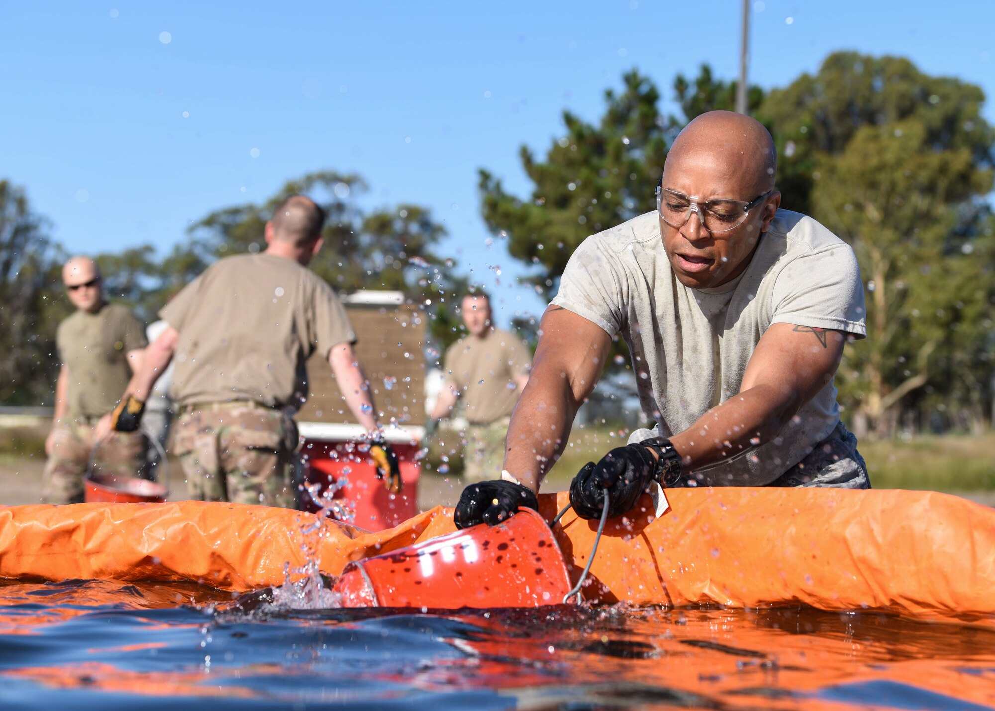 Service members participate in the 2019 Fire Muster Challenge to commemorate Fire Prevention Week Oct. 10, 2019, at Vandenberg Air Force Base, Calif. During the event, five-member teams competed in events such as a firetruck pull, bucket brigade and an obstacle course to be the champion of the 2019 Fire Muster Challenge. (U.S. Air Force photo by Airman 1st Class Aubree Milks)