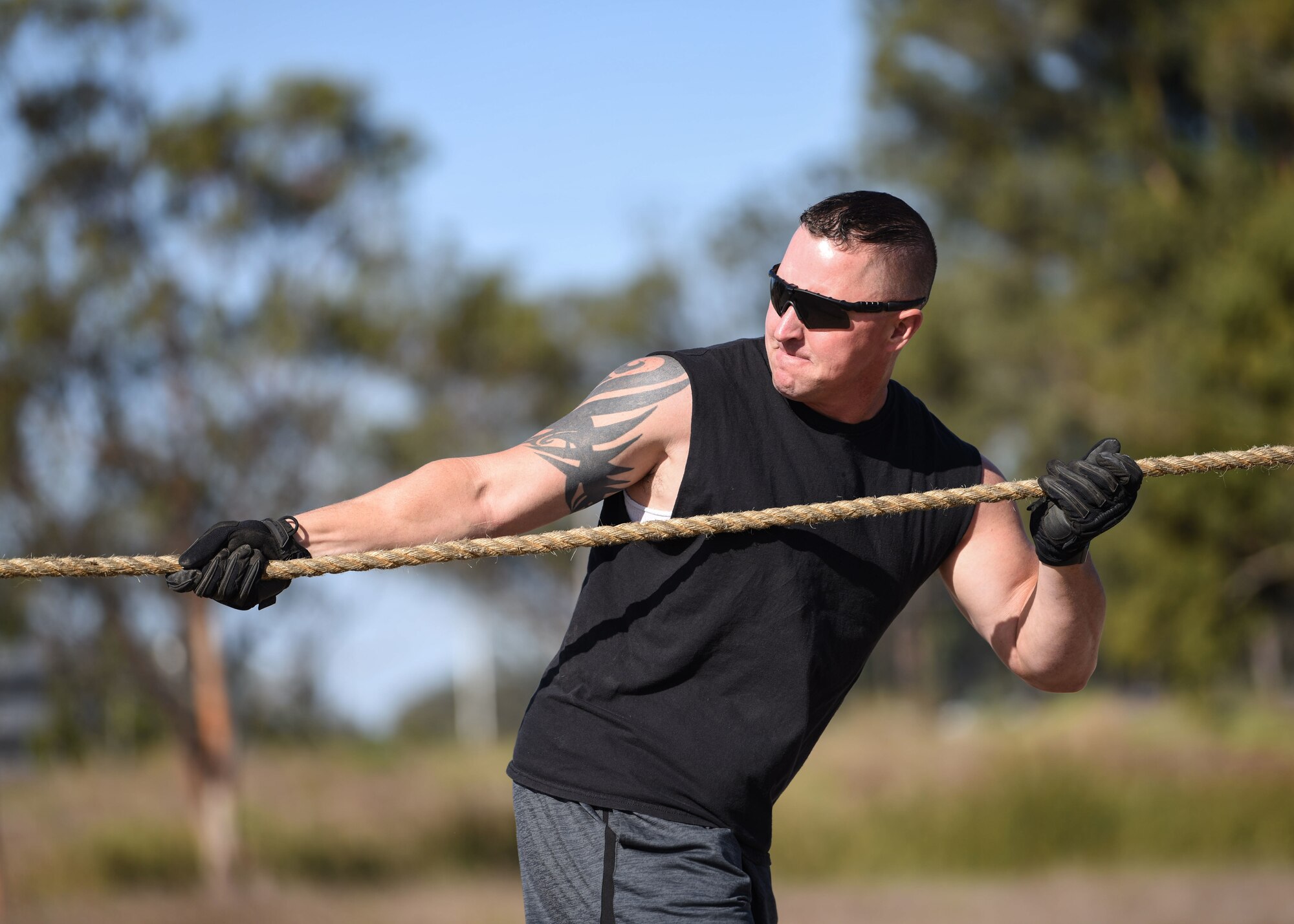 Master Sgt. David Carr, 30th Civil Engineer Squadron builder assessment team NCO in charge, attempts to drag a firetruck 20 yards during the 2019 Fire Muster Challenge Oct. 10, 2019, at Vandenberg Air Force Base, Calif. During the event, five-member teams competed in various events such as a firetruck pull, bucket brigade and an obstacle course. (U.S. Air Force photo by Airman 1st Class Aubree Milks)