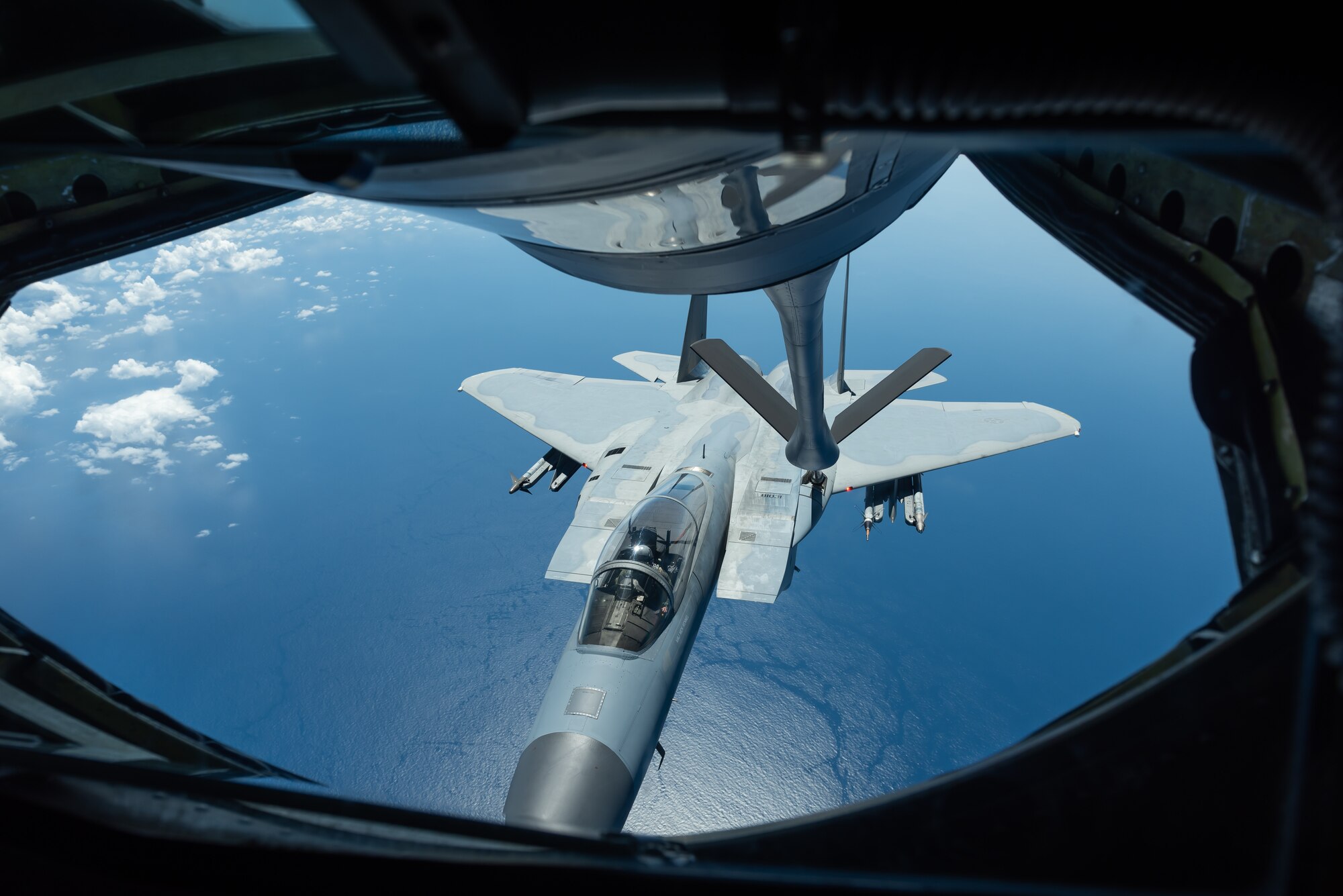 An F-15C Eagle from the 44th Fighter Squadron refuels with a KC-135 Stratotanker from the 909th Air Refueling Squadron Oct. 3, 2019, during a training exercise out of Kadena Air Base, Japan. The 909th ARS helps ensure a free-and-open Indo-Pacific by providing air refueling to U.S., allies and partners within their area of responsibility. (U.S. Air Force photo by Senior Airman Matthew Seefeldt)