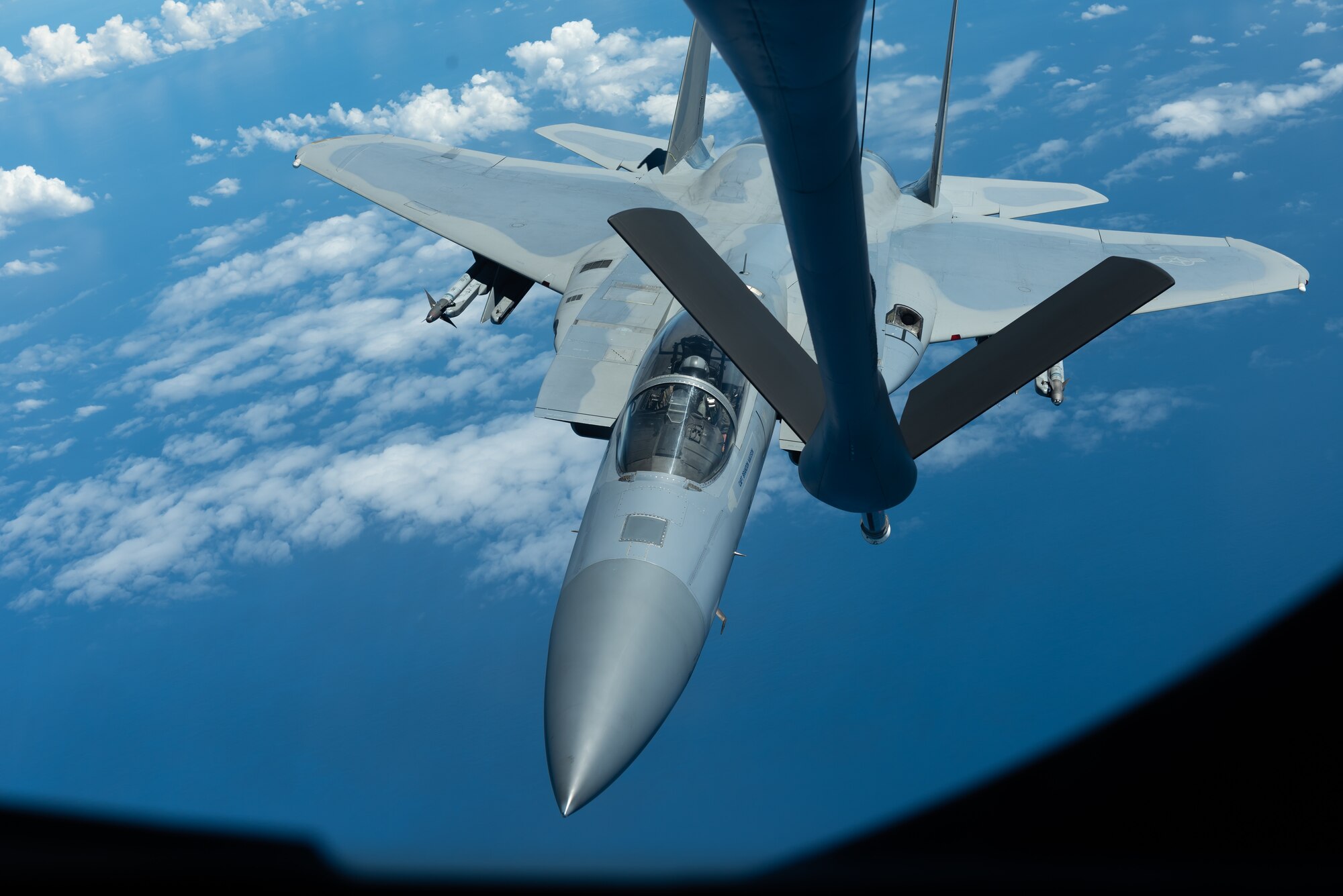 An F-15C Eagle from the 44th Fighter Squadron prepares to refuel with a KC-135 Stratotanker from the 909th Air Refueling Squadron Oct. 3, 2019, during a training exercise out of Kadena Air Base, Japan. The 909th ARS helps ensure a free-and-open Indo-Pacific by providing air refueling to U.S., allies and partners within their area of responsibility. (U.S. Air Force photo by Senior Airman Matthew Seefeldt)
