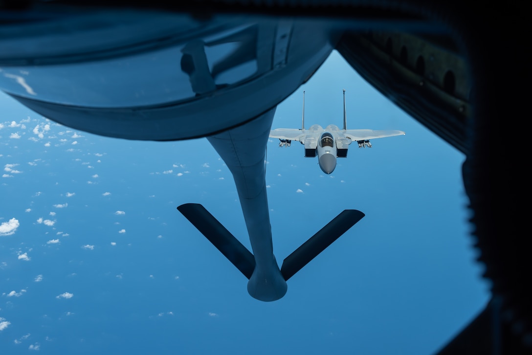An F-15C Eagle from the 44th Fighter Squadron prepares to refuel with a KC-135 Stratotanker from the 909th Air Refueling Squadron Oct. 3, 2019, during a training exercise out of Kadena Air Base, Japan. The 909th ARS helps ensure a free-and-open Indo-Pacific by providing air refueling to U.S., allies and partners within their area of responsibility. (U.S. Air Force photo by Senior Airman Matthew Seefeldt)