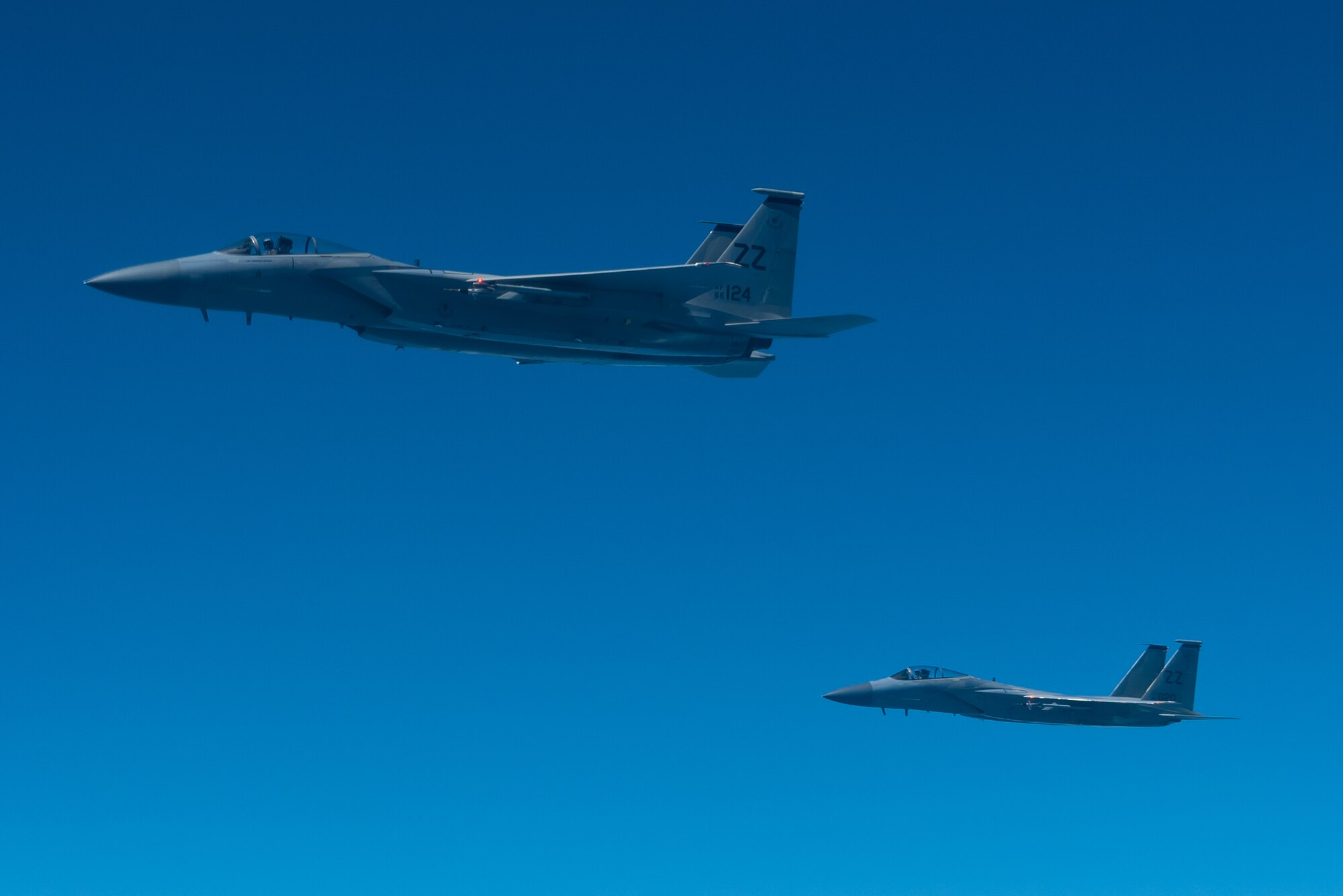 Two F-15C Eagles from the 44th Fighter Squadron fly during a training exercise Oct. 3, 2019, out of Kadena Air Base, Japan. The F-15C Eagle is an all-weather, extremely maneuverable, tactical fighter designed to permit the Air Force to gain and maintain air supremacy over the battlefield. (U.S. Air Force photo by Senior Airman Cynthia Belío)