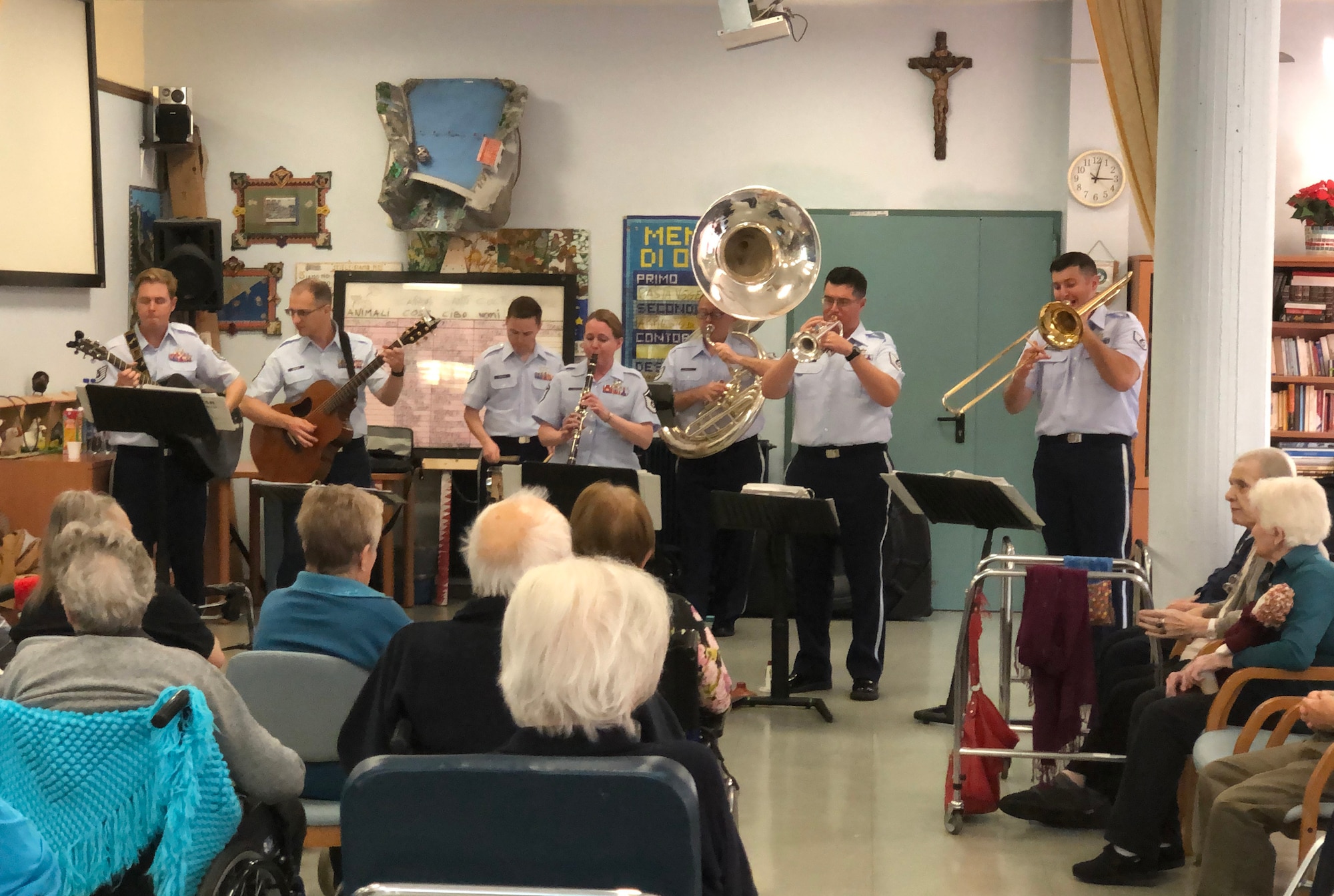 U.S. Air Forces in Europe and Air Forces Africa band, Wings of Dixie, play for residents at a community elderly home in Aviano, Italy, Oct. 3, 2019. Wings of Dixie travels throughout Europe and Africa playing their version of up-beat, toe-tapping Dixieland jazz. (U.S. Air Force photo by Julie Scott)