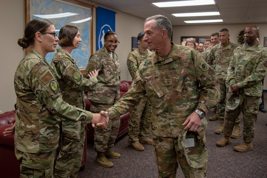 Air Force Chief of Staff Gen. David L. Goldfein presents a coin to U.S. Air Force Master Sgt. Bridget Baydal, logistics team sergeant assigned to the 818th Mobility Support Advisory Squadron, during their visit to the U.S. Air Force Expeditionary Center as part of 2019 Fall Phoenix Rally, Oct. 9, 2019, at Joint Base McGuire-Dix-Lakehurst, New Jersey. Fall Phoenix Rally is a three-day summit focused on understanding leadership roles in emerging issues with Air Mobility Command, bringing together leadership and spouses from throughout the command.