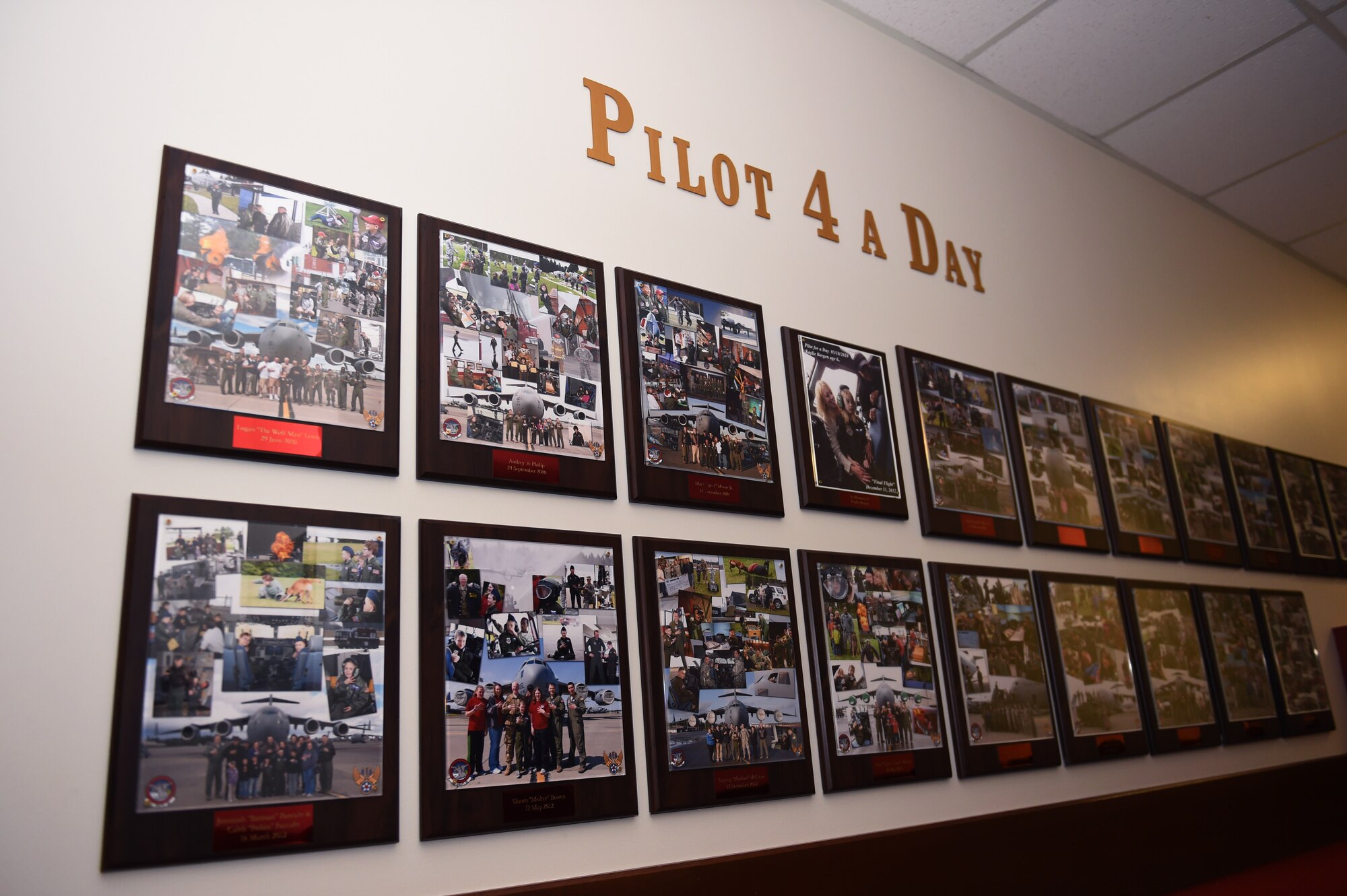The "Pilot 4 a Day" wall in the 4th Airlift Squadron on Joint Base Lewis-McChord, Wash., displays past Pilot for a day program participants. This wall showcases particpants starting from 2010 when the program was revamped by the Air Force Association and the 4th Airlift Squadron.