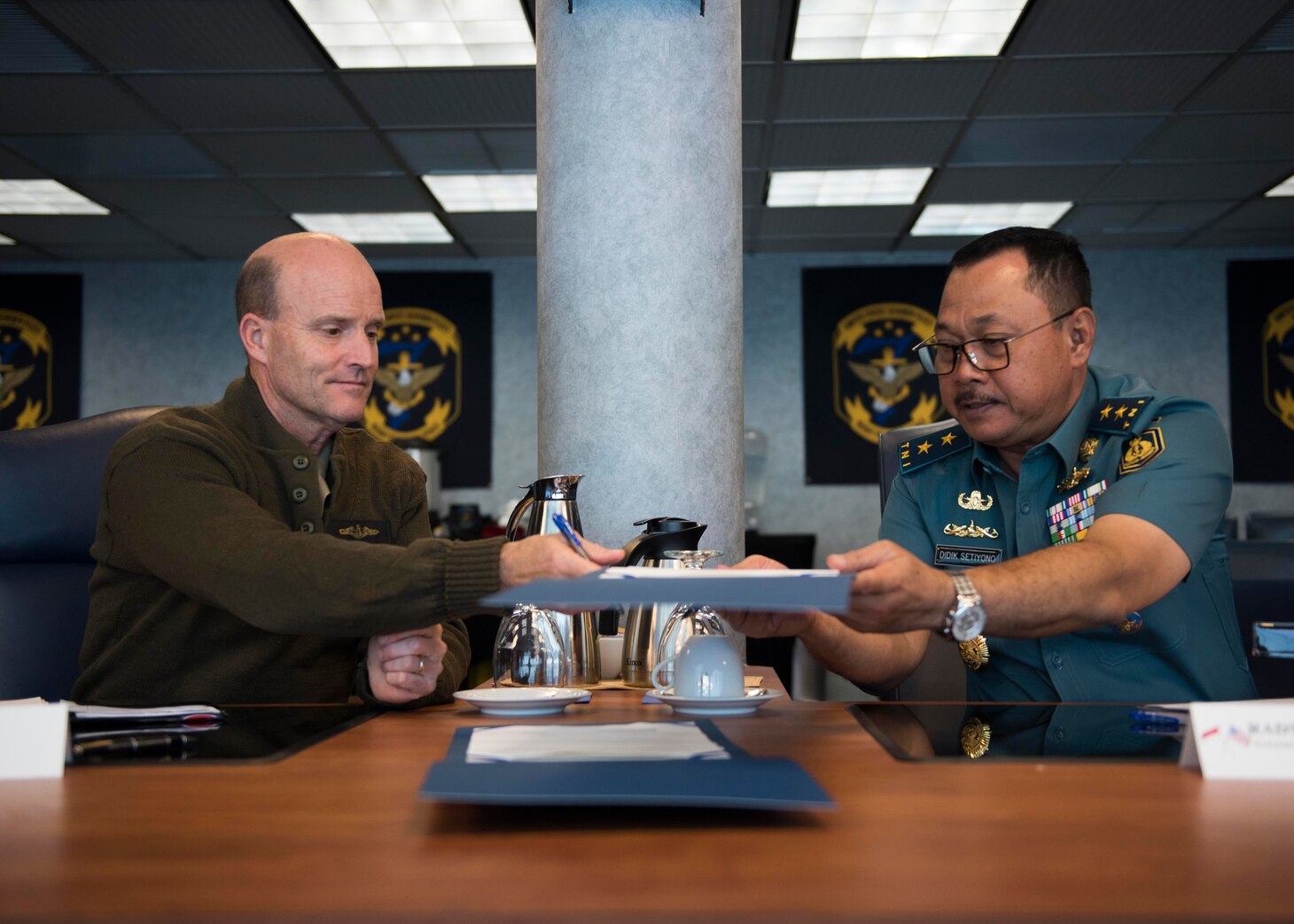Vice Adm. Bill Merz, commander, U.S. 7th, Fleet signed minutes with Rear Adm. Didik Setiyono, Assistant Chief of Navy Indonesian Navy, aboard the U.S. 7th Fleet flagship, USS Blue Ridge (LCC 19), during staff talks with the Indonesian Navy, October 11, 2019. The Indonesian Navy’s visit to U.S. 7th Fleet headquarters is highlighted by this year’s marking of the 70th anniversary of diplomatic ties between the United States and Indonesia.