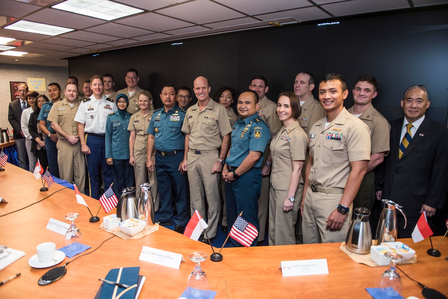 U.S. Sailors pose for a photo with diplomats and Sailors from the Indonesian Navy, aboard the U.S. 7th Fleet flagship, USS Blue Ridge (LCC 19), during staff talks with the Indonesian Navy, October 11, 2019. The Indonesian Navy’s visit to U.S. 7th Fleet headquarters is highlighted by this year’s marking of the 70th anniversary of diplomatic ties between the United States and Indonesia.