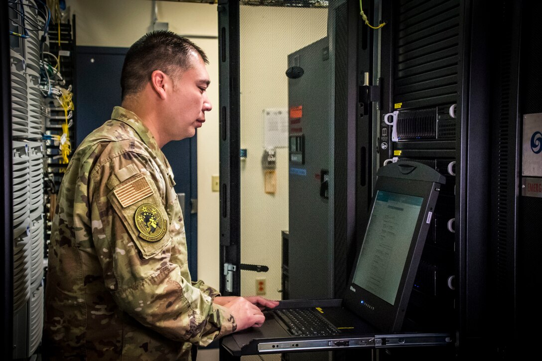 U.S. Air Force Senior Master Sgt. Nick Wirwille, the superintendent of the cyber systems operations shop assigned to the Communications Squadron at the 179th Airlift Wing, Ohio Air National Guard, works on a computer Oct. 6, 2019, at the 179th AW in Mansfield, Ohio. Cyber systems operations specialists design, install and support systems to ensure they operate properly and remain secure from outside intrusion. (U.S. Air National Guard photo by Airman 1st Class Alexis Wade)