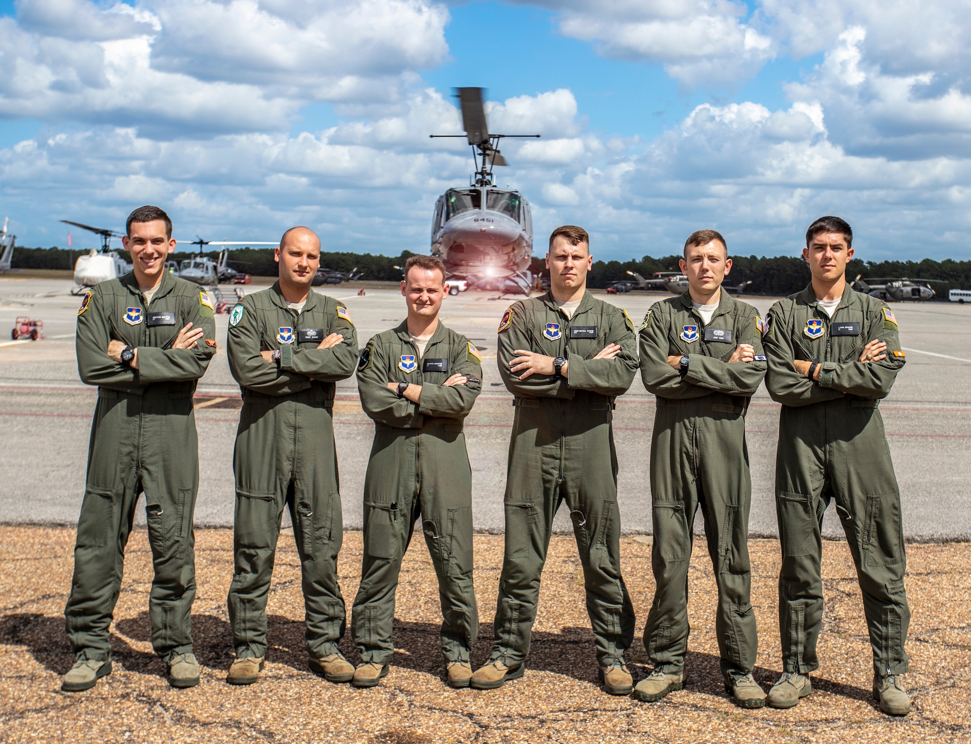 (From left to right) U.S. Air Force students 1st Lt. Matthew Gulotta, 2nd Lt. Trent Badger, 2nd Lt. Richard Songster, 2nd Lt. John Michael Thrash, Capt. Josh Park and 2nd Lt Karl Bossard stand in front of a TH-1H helicopter at Fort Rucker, Ala., Oct. 10, 2019. All six officers graduated from Specialized Undergraduate Pilot Training - Helicopter Class 20-02, which incorporated virtual reality in an experimental curriculum that resulted in the class graduating six weeks earlier than normal training classes while reducing actual flying time in the TH-1H by about 35%. (U.S. Air Force courtesy photo/Brian Braden)