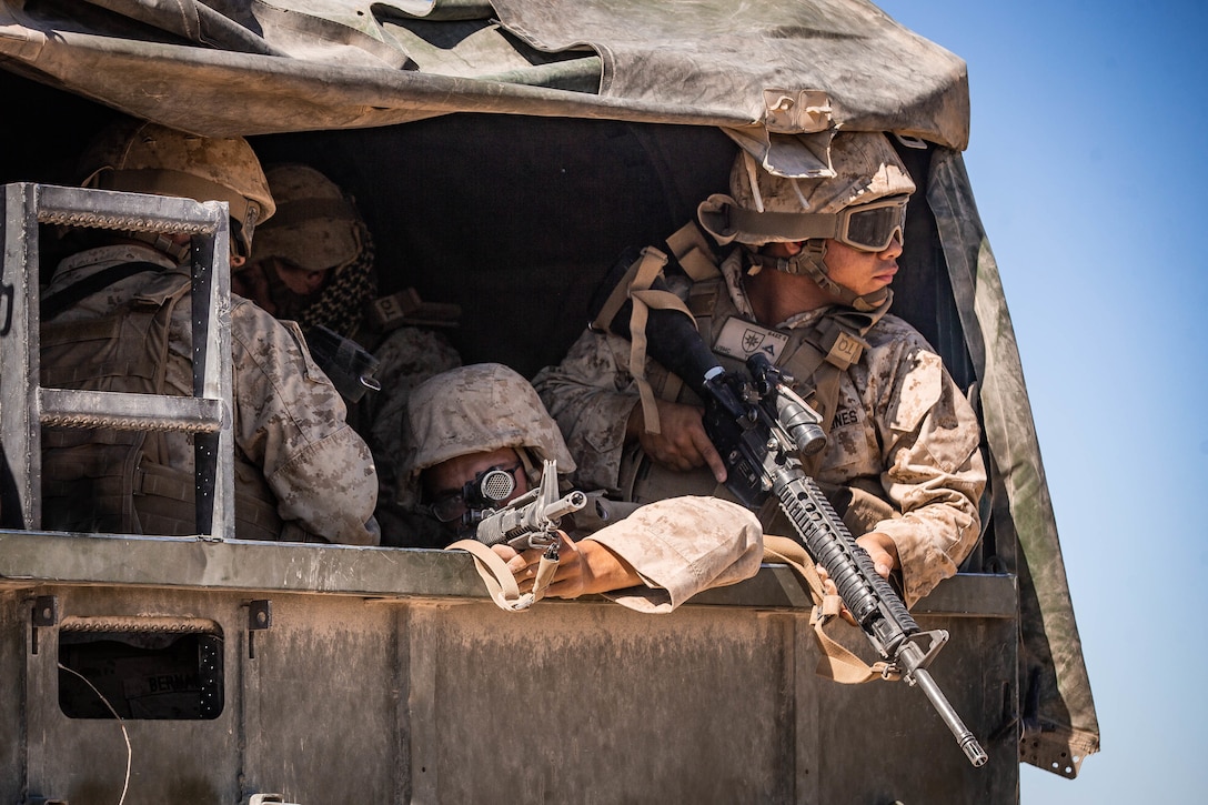 U.S. Marines with Combat Logistics Battalion 8, Combat Logistics Regiment 2, 2nd Marine Logistics Group, provide security out of the back of a Medium Tactical Vehicle Replacement during motorized operations course as part Integrated Training Exercise 1-20 on Marine Corps Air Ground Combat Center Twentynine Palms, California, Oct. 6, 2019. CLB-8 integrated with 2nd Marine Regiment during ITX to provide direct support and tactical logistics beyond the regiment's organic capabilities in the areas of transportation, field level maintenance, and general engineering.