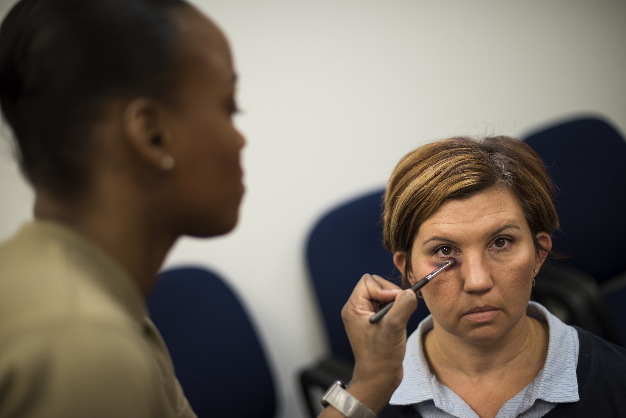 Volunteers use makeup to emulate a black eye as part of a Family Advocacy Program initiative called “The Black Eye Project” on Joint Base McGuire-Dix-Lakehurst, New Jersey, Oct. 9, 2019. The volunteers went about their normal routines around base with a fake black eye as an experiment to see who would inquire about the individuals’ wellbeing and who avoided it. The goal is to help the community learn how to speak out and recognize symptoms of domestic violence which is severely under-reported, according to Family Advocacy. Within five hours, 50 people approached the volunteers— five were outside of their workplace. While many asked with concern, some initially approached with inappropriate jokes or comments. Two volunteers entered the installation through three separate gates and were not questioned. “We hope to use this as a learning experience for people to start a conversation,” said Christina Hernandez, 87th Family Advocacy Program domestic abuse victim advocate. “Be aware, ask the question even if it’s uncomfortable. Family violence thrives in silence and isolation and it’s the job of all of us to shine a light and show survivors that they are not alone.” (U.S. Air Force photos by Airman 1st Class Ariel Owings)