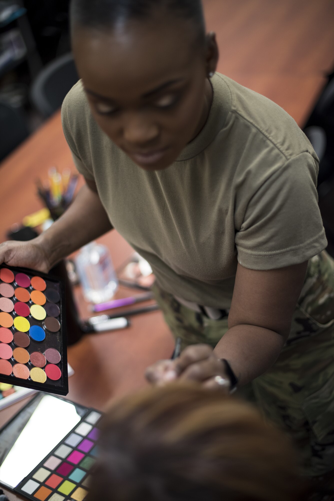 Volunteers use makeup to emulate a black eye as part of a Family Advocacy Program initiative called “The Black Eye Project” on Joint Base McGuire-Dix-Lakehurst, New Jersey, Oct. 9, 2019. The volunteers went about their normal routines around base with a fake black eye as an experiment to see who would inquire about the individuals’ wellbeing and who avoided it. The goal is to help the community learn how to speak out and recognize symptoms of domestic violence which is severely under-reported, according to Family Advocacy. Within five hours, 50 people approached the volunteers— five were outside of their workplace. While many asked with concern, some initially approached with inappropriate jokes or comments. Two volunteers entered the installation through three separate gates and were not questioned. “We hope to use this as a learning experience for people to start a conversation,” said Christina Hernandez, 87th Family Advocacy Program domestic abuse victim advocate. “Be aware, ask the question even if it’s uncomfortable. Family violence thrives in silence and isolation and it’s the job of all of us to shine a light and show survivors that they are not alone.” (U.S. Air Force photos by Airman 1st Class Ariel Owings)