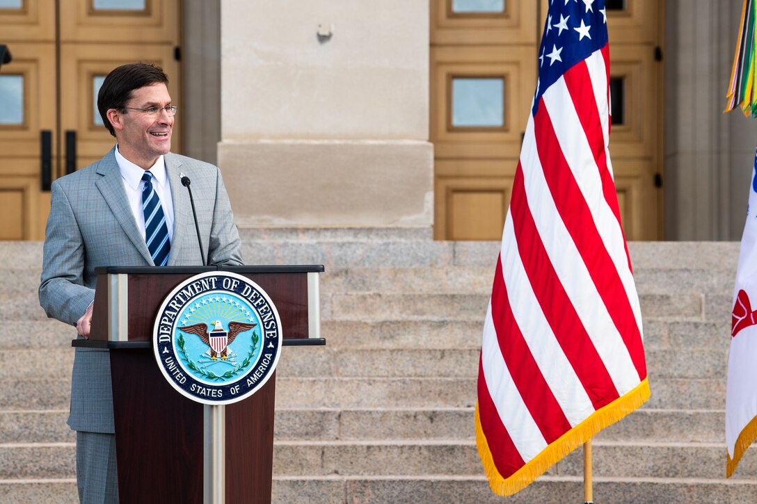 Defense Secretary Dr. Mark T. Esper speaks at a lectern