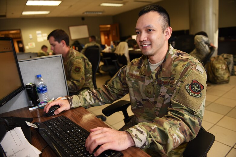 U.S. Air Force Staff Sgt. Mark Hedge, 660th Aircraft Maintenance Squadron aerospace propulsion craftsman, logs on to his computer Oct. 8, 2019, at Travis Air Force Base, California. Hedge was recognized as the 60th Air Mobility Wing Warrior of the Week for Oct. 6-12, 2019. The program highlights a Travis Airman or noncommissioned officer for his or her outstanding performance. (U.S. Air Force photo by Airman 1st Class Cameron Otte) (This photo has been altered for security purposes.)