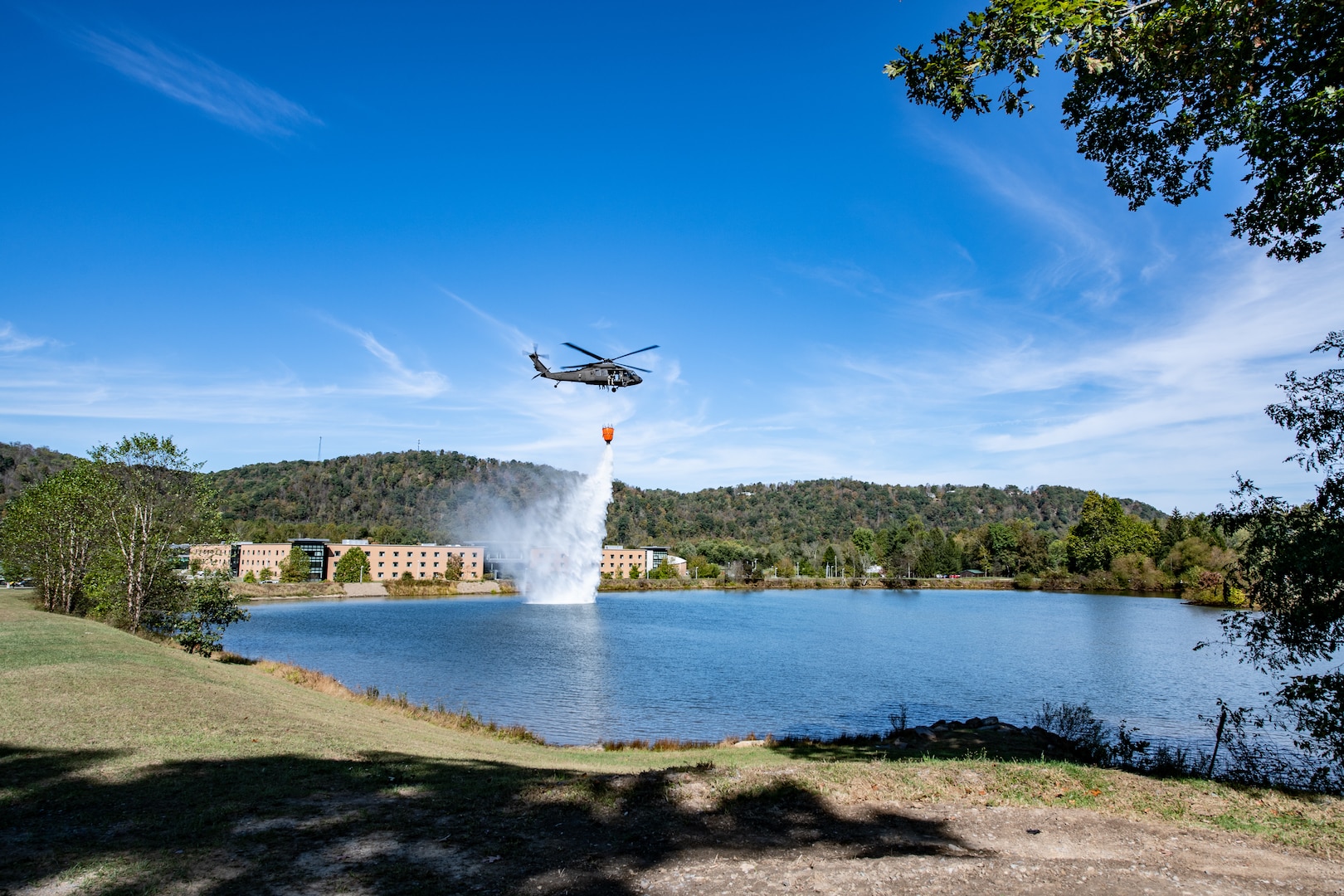 Members of the West Virginia Army National Guard's (WVARNG) Company C, 1st Battalion, 150th Aviation Regiment completed Bambi Bucket training for three aircrews consisting of 12 Soldiers at Camp Dawson, West Virginia, Oct. 10, 2019. This type of familiarization training ensures that aircrew members can successfully link up with civilian firefighting agencies to provide response to wildfire incidents in the State of West Virginia. (U.S. National Guard photo by Edwin Wriston)