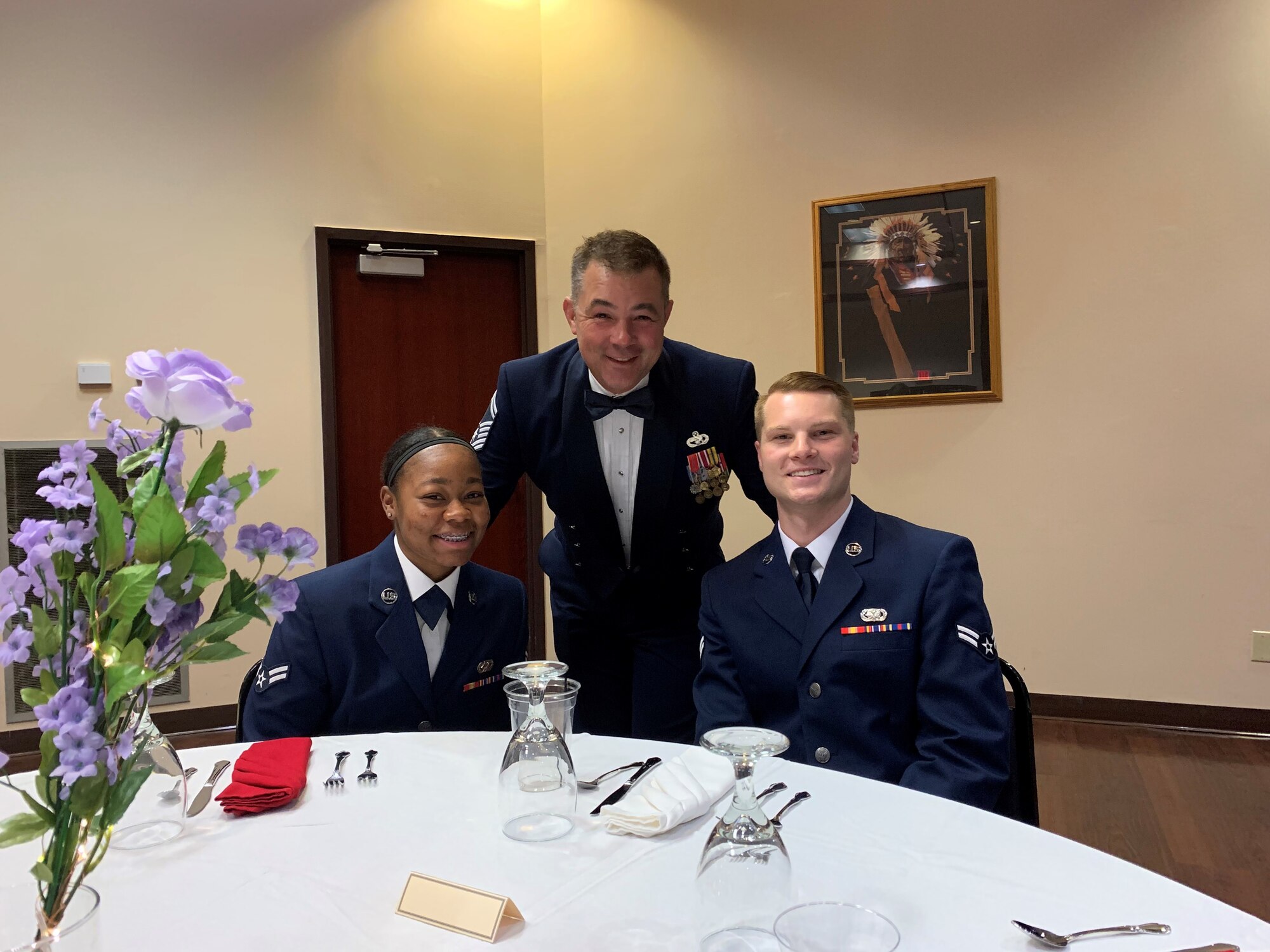 U.S. Air Force Senior Master Sgt. Anthony Krebs, the deployment and distribution flight superintendent assigned to the 97th Logistics Readiness Squadron, poses with Airmen that he leads