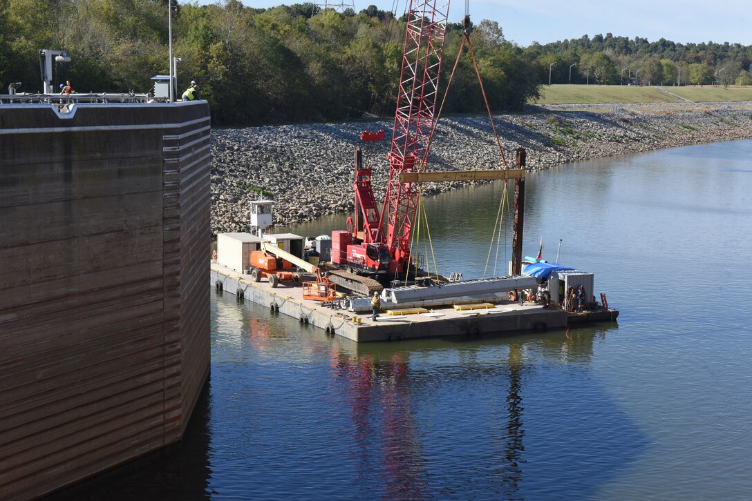 Fish Guidance Systems crew prepares to install a section of the bio acoustic fish fence Oct. 9, 2019 on the riverbed below Barkley Lock in Grand Rivers, Ky. The BAFF is expected to be operational in a few weeks, and a field trial is set to test the effectiveness.  The project involves multiple agencies and partners, including U.S. Fish and Wildlife Service, Kentucky Department of Fish and Wildlife Resources, U.S. Army Corps of Engineers Nashville District, U.S. Geological Survey and Tennessee Wildlife Resources Agency. (USACE photo by Lee Roberts)