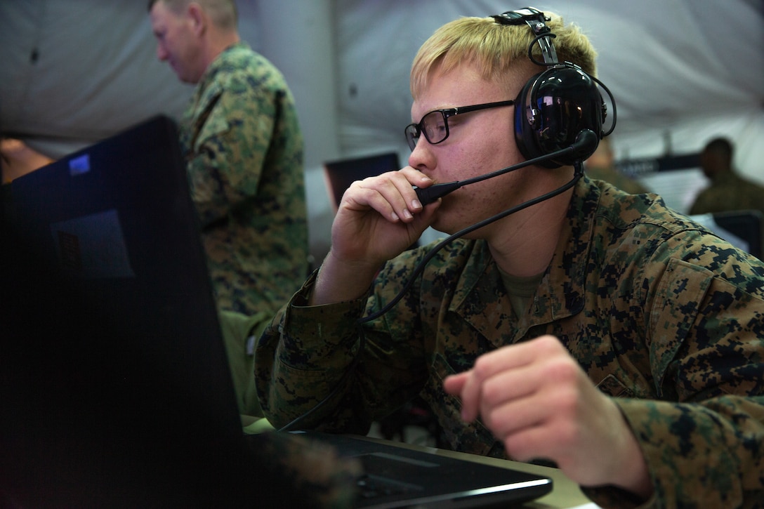 Marine Cpl. Brandon T. Hill performs a communications check during Exercise Pegasus Flight at Marine Corps Air Station Cherry Point, North Carolina, Sept. 30, 2019. Marine Tactical Air Command Squadron 28 supported Pegasus Flight by planning, commanding, directing and supervising all air operations as the tactical air command center for the exercise. Hill is an air support operations operator with MTACS-28, Marine Air Control Group 28, 2nd Marine Aircraft Wing. (U.S. Marine Corps photo by Pfc. Steven M. Walls)