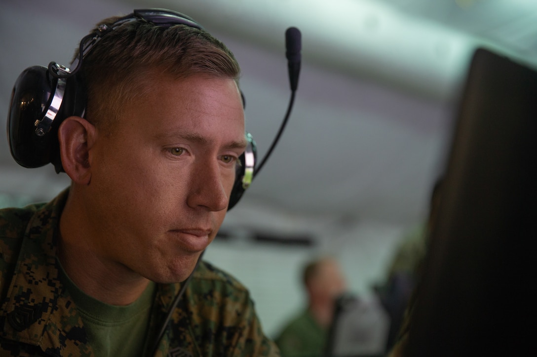 Gunnery Sgt. Zachary S. Crone executes a communications check during Exercise Pegasus Flight at Marine Corps Air Station Cherry Point, North Carolina, Oct. 1, 2019. Marine Tactical Air Command Squadron 28 supported Pegasus Flight by planning, commanding, directing and supervising all air operations as the tactical air command center for the exercise. Crone is a tactical air defense controller with MTACS-28, Marine Air Control Group 28, 2nd Marine Aircraft Wing. (U.S. Marine Corps photo by Pfc. Steven M. Walls)