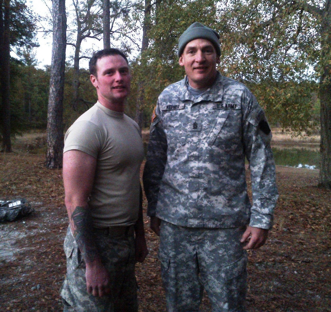 New York Army National Guard Sgt. Thomas Carpenter (left) takes a break with 28th Infantry Division Command Sgt. Maj. Chris Kepner during a competition to identify candidates for the three, two-man Army National Guard Best Ranger Teams on Nov. 20, 2014, at Fort Benning, Ga.Carpenter will  attend the Brazilian Army Jungle Warfare Training Center Oct. 20 to Nov. 30, 2019.