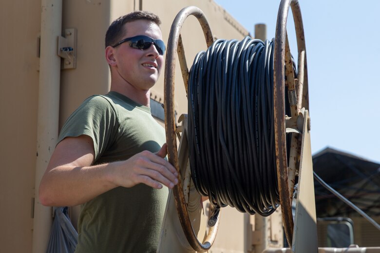 Marine Sgt. Nicholas A. Ashman secures network cables for transport during Exercise Pegasus Flight at Marine Corps Air Station Cherry Point, North Carolina, Oct. 2, 2019. Marine Air Control Squadron 2 supported Pegasus Flight by providing air surveillance, airspace management, identifying and classifying radar tracks as the tactical air operations center for the exercise. Ashman is an aviation communication systems technician with MACS-2, Marine Air Control Group 28, 2nd Marine Aircraft Wing, (U.S. Marine Corps photo by Pfc. Steven M. Walls)