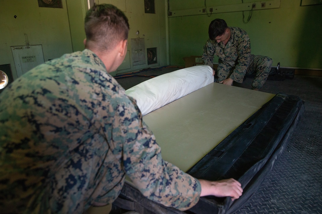 Marines assigned to Marine Air Control Squadron 2 break down a table during Exercise Pegasus Flight at Marine Corps Air Station Cherry Point, North Carolina, Oct. 2, 2019. MACS-2 supported Pegasus Flight by providing air surveillance, airspace management, identifying and classifying radar tracks as the tactical air operations center for the exercise. MACS-2 is a part of Marine Air Control Group 28, 2nd Marine Aircraft Wing. (U.S. Marine Corps photo by Pfc. Steven M. Walls)