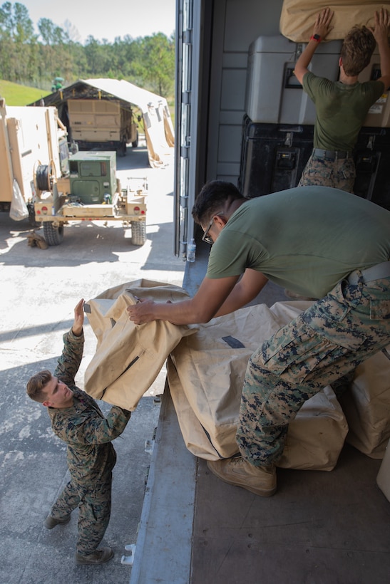 Marines assigned to Marine Air Control Squadron 2 pack up a communications system during Exercise Pegasus Flight at Marine Corps Air Station Cherry Point, North Carolina, Oct. 2, 2019. MACS-2 supported Pegasus Flight by providing air surveillance, airspace management, identifying and classifying radar tracks as the tactical air operations center for the exercise. MACS-2 is a part of Marine Air Control Group 28, 2nd Marine Aircraft Wing. (U.S. Marine Corps photo by Pfc. Steven M. Walls)