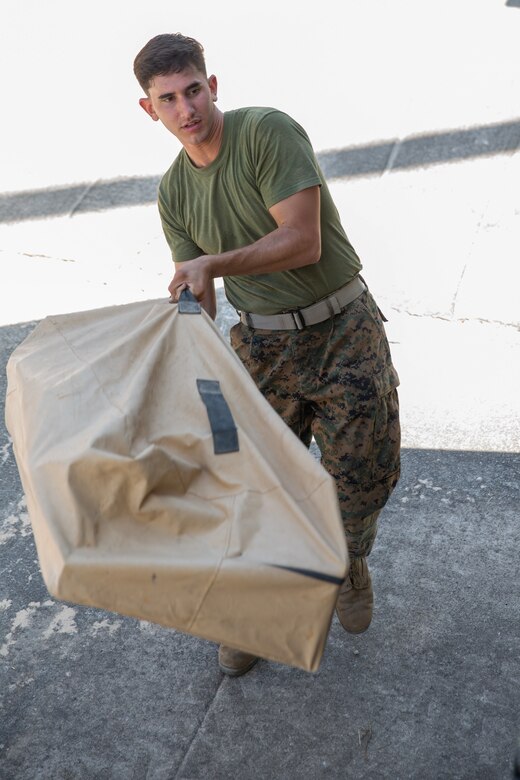 Marine Cpl. Jonathan L. Perez packs up a communications system during Exercise Pegasus Flight at Marine Corps Air Station Cherry Point, North Carolina, Oct. 2, 2019. Marine Air Control Squadron 2 supported Pegasus Flight by providing air surveillance, airspace management, identifying and classifying radar tracks as the tactical air operations center for the exercise. Perez is an engineer equipment electrical systems technician with MACS-2, Marine Air Control Group 28, 2nd Marine Aircraft Wing. (U.S. Marine Corps photo by Pfc. Steven M. Walls)