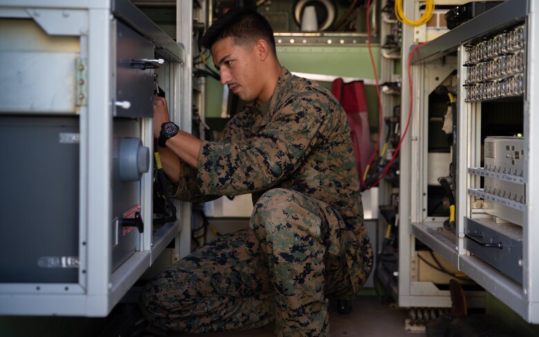 Marine Cpl. Brandon R. Rusch changes frequencies on a radio during Exercise Pegasus Flight at Marine Corps Air Station Cherry Point, North Carolina, Oct. 2, 2019. Marine Air Communications Squadron 2 supported Pegasus Flight by providing air surveillance, airspace management, identifying and classifying radar tracks as the tactical air operations center for the exercise. Rusch is an aviation communications systems technician with MACS-2. (U.S. Marine Corps photo by Pfc. Steven Walls)