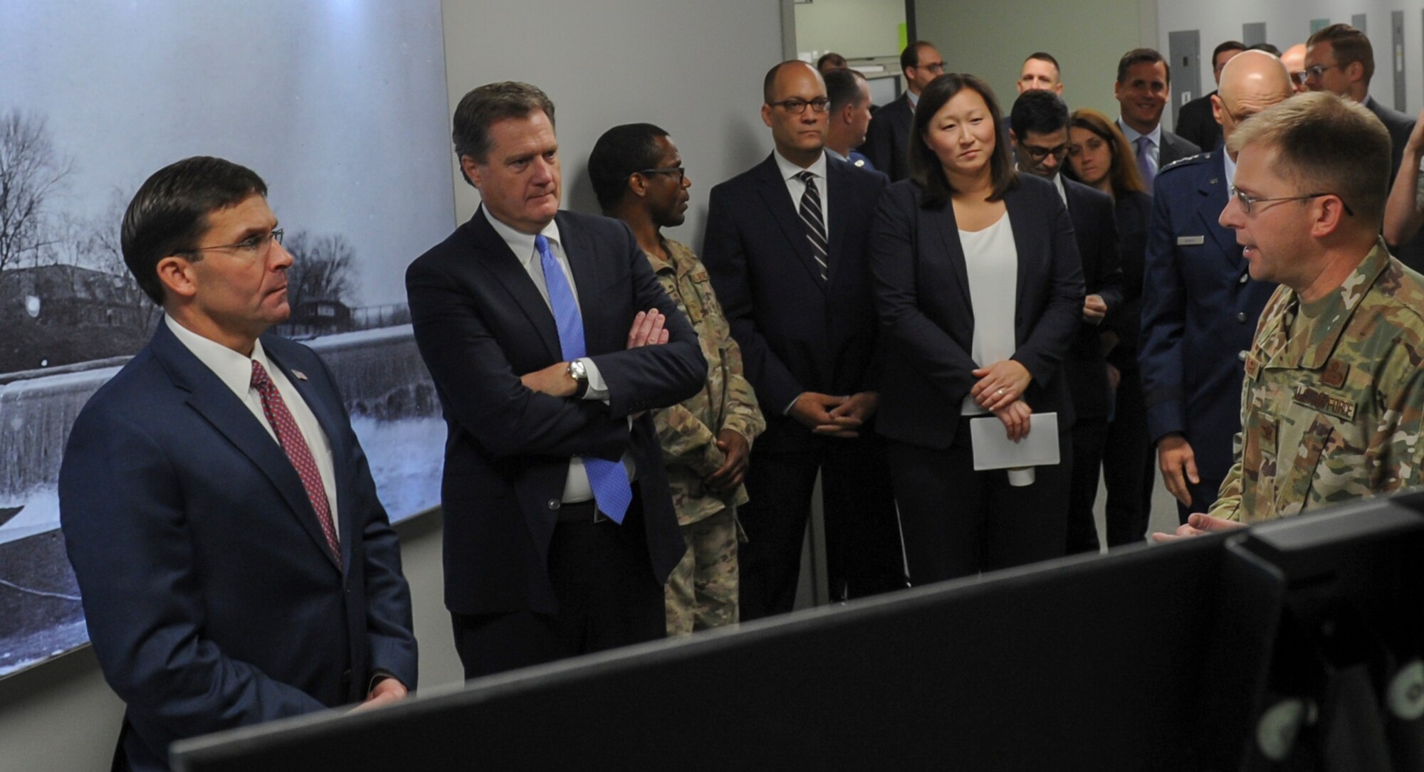 Col. Parker Wright, National Air and Space Intelligence Center commander, briefs Secretary of Defense Dr. Mark T. Esper during his visit to Wright-Patterson Air Force Base, Ohio on Oct. 4, 2019. Wright highlighted NASIC’s capabilities and responsibilities during Esper’s trip to the center