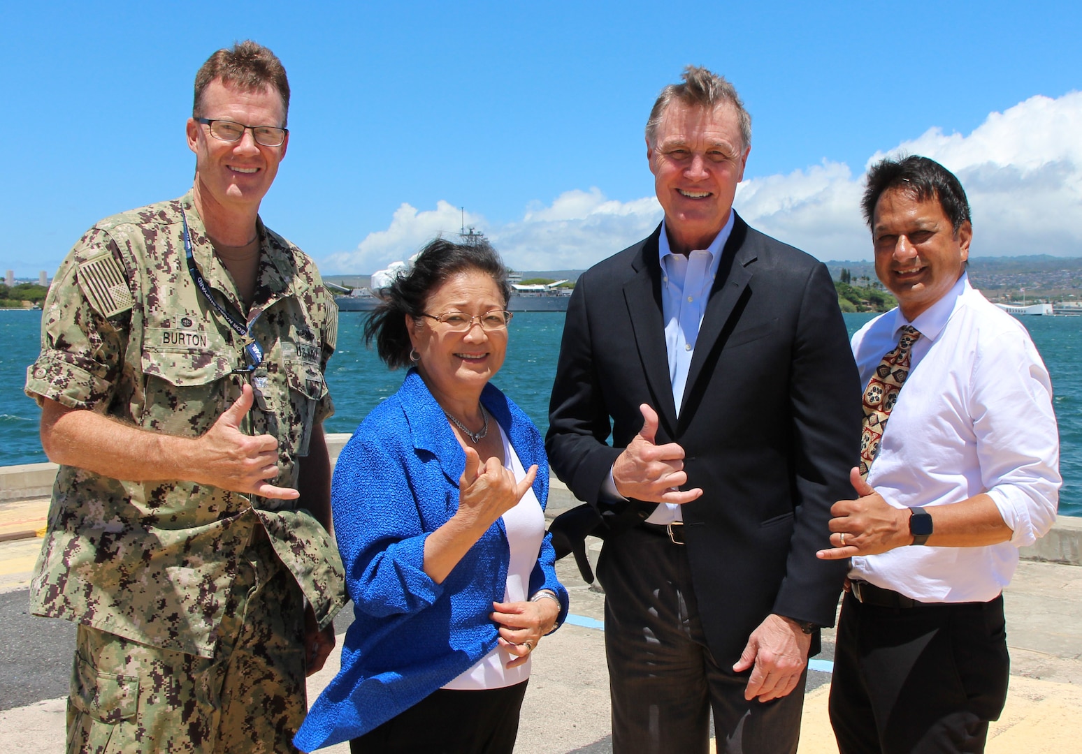 Commander of Pearl Harbor Naval Shipyard and Intermediate Maintenance Facility Capt. Greg Burton (left), Sen. Mazie Hirono of Hawaii, Sen. David Perdue, and Nuclear Engineering & Planning Manager Kaipo Crowell (Right) overlooking the USS Arizona Memorial and Battleship Missouri Memorial.