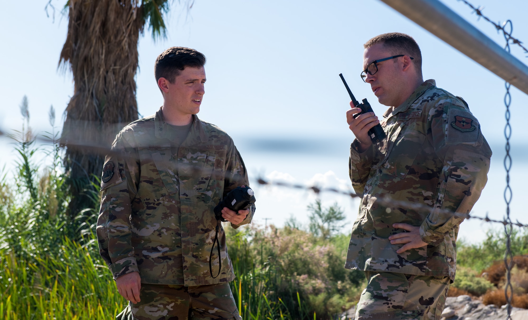 Senior Airman Joseph Bahr (left), 56th Aeromedicine Squadron bioenvironmental technician, and Staff Sgt. Eric Roberts, 56th Aeromedicine Squadron noncommissioned officer in charge of Radiation and Safety Operations Element, monitor volatile organic compounds in the air during a fuel spill exercise Oct. 4, 2019, at Luke Air Force Base, Ariz.
