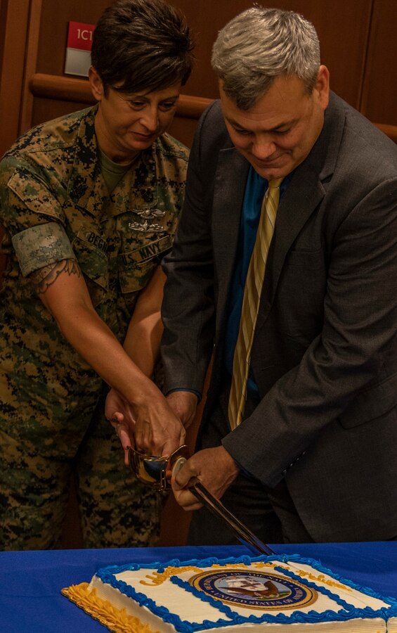 Senior Chief Petty Officer Lanna Begnaud, left, the senior enlisted leader for 4th Marine Division, and Gregg T. Habel, right, the executive director of Marine Forces Reserve and Marine Forces North, cut the Navy’s ceremonial birthday cake at Marine Corps Support Facility New Orleans, Oct. 11, 2019. MARFORRES is comprised of active and reserve Marines and Sailors, both groups are crucial to our mission and neither could succeed without the other. MARFORRES has a total of 1,554 U.S. Navy Sailors, who are geographically dispersed across 160 sites to include the continental U.S., Hawaii, Alaska and Puerto Rico. (U.S. Marine Corps photo by Pfc. Leslie Alcaraz)