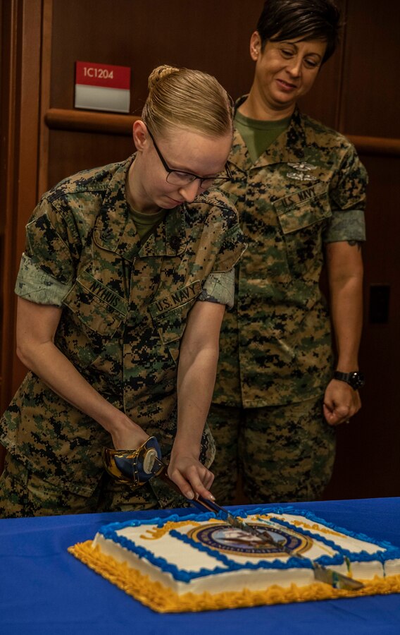 Petty Officer 3rd Class Trista Nyhuis, a religious program specialist with Headquarters Battalion and the ceremony’s junior Sailor, cuts into the ceremonial birthday cake at Marine Corps Support Facility New Orleans, Oct. 11, 2019. Marine Forces Reserve has a total of 1,554 U.S. Navy Sailors across 160 Home Training Centers supporting MARFORRES’s mission to keep our honor clean as a Reserve force that’s ready to fight and win our nation’s battles. (U.S. Marine Corps photo by Pfc. Leslie Alcaraz)