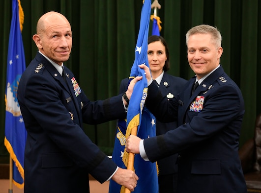 Lt. Gen. Timothy Haugh (right) assumes command of Sixteenth Air Force from Gen. Mike Holmes, commander of Air Combat Command, during the Sixteenth Air Force Assumption of Command at Joint Base San Antonio-Lackland, Texas, Oct. 11, 2019. Twenty-Fourth and Twenty-Fifth Air Forces were inactivated during the ceremony to integrate into the new information warfare Numbered Air Force. Sixteenth Air Force is responsible for providing IW capabilities to combatant commanders with the speed to match today’s technological environment. (U.S. Air Force photo by Tech. Sgt. R.J. Biermann)