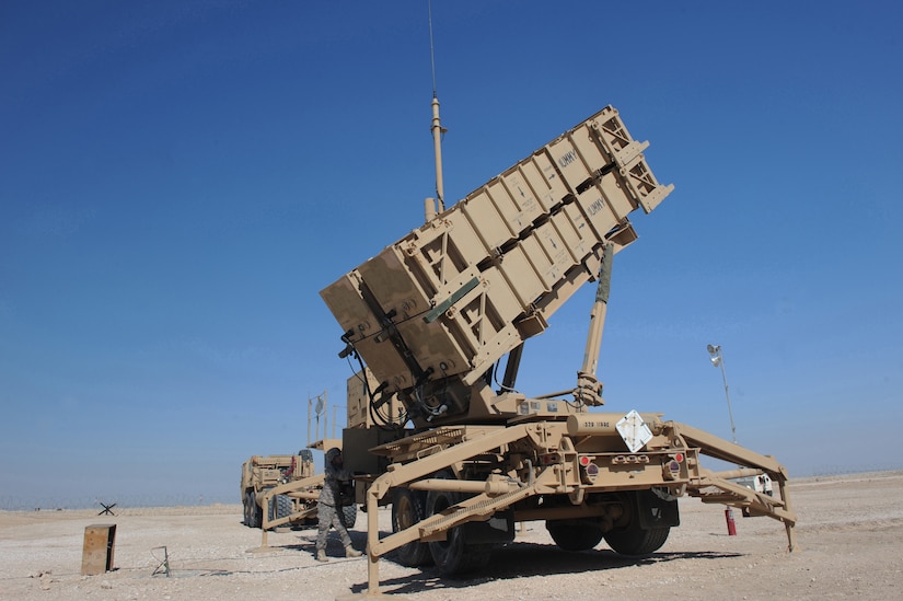 A soldier performs operations on missile launch system.