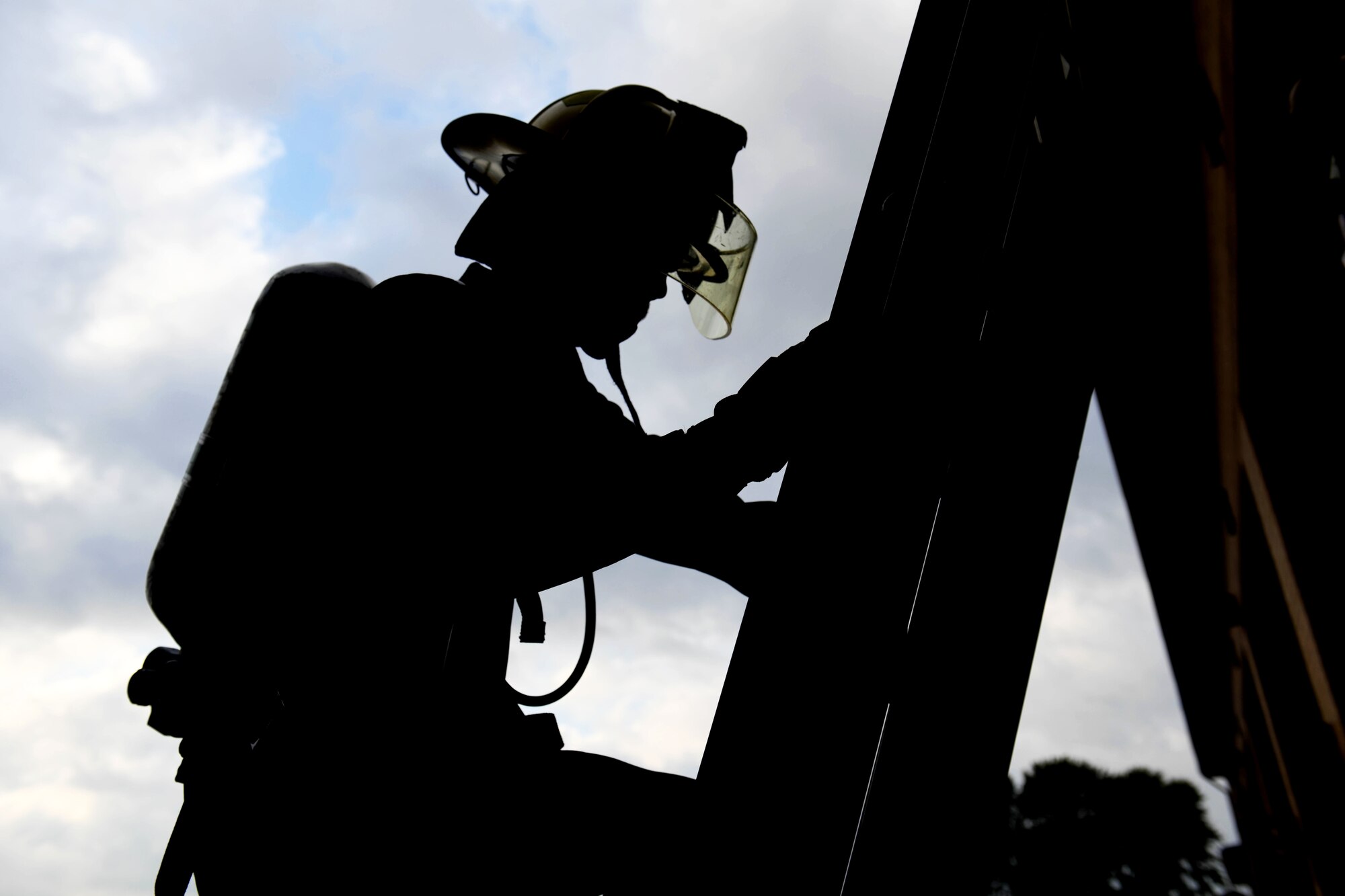 Staff Sgt. Caleb Hibbeler, 22nd Wing Staff Agencies commander support staff NCO in charge, climbs a ladder during the Fire Muster competition Oct. 10, 2019, at McConnell Air Force Base, Kan. The morale event is held annually by McConnell’s Fire Department as part of fire prevention week. (U.S. Air Force photo by Airman 1st Class Nilsa E. Garcia)