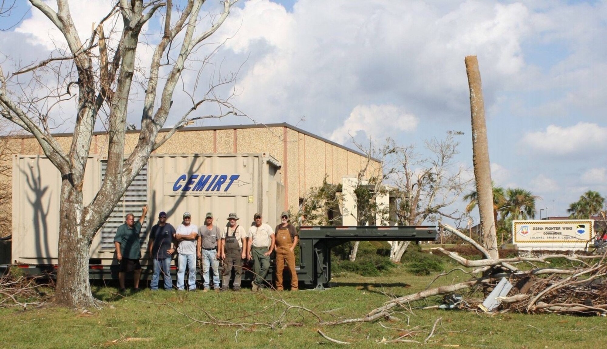 Members of CEMIRT, seen here in front of the 325th Fighter Wing building at Tyndall AFB, hooked up 17 generators for a total of 3.4 megawatts of power in the first nine days post-Hurricane Michael.