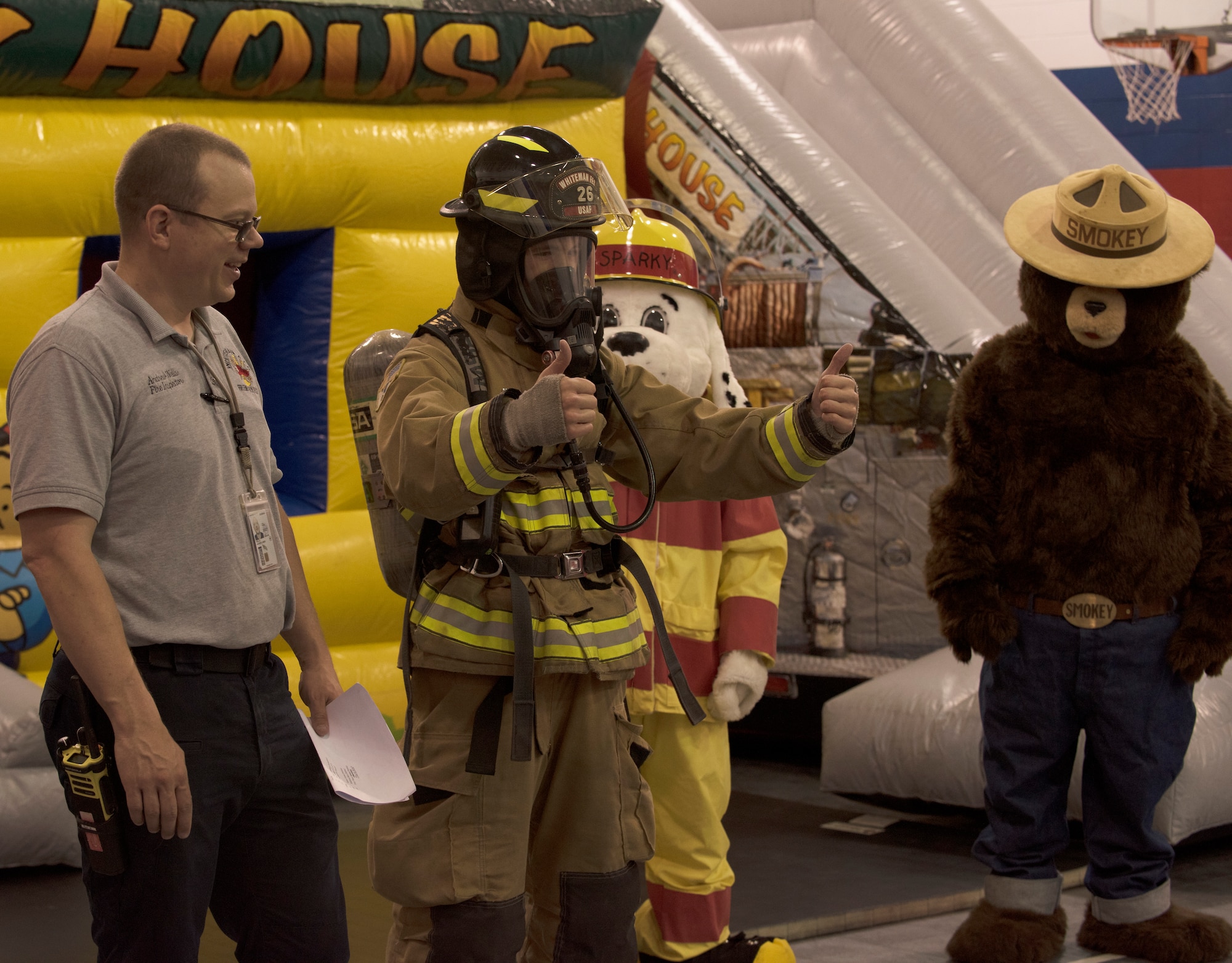 Members of the Fire and Emergency Services Team talk to a first grade class from Whiteman Elementary on October 10, 2019, at Whiteman Air Force Base, Missouri. The 2019 Fire Prevention Week campaign theme is "Not Every Hero Wears a Cape. Plan and Practice Your Escape". (U.S. Air Force photo by Staff Sgt. Kayla White)