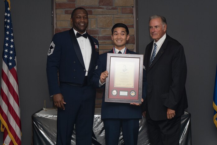 Senior Airman Richard Kim, Airman Leadership School graduate, accepts the John L. Levitow award during the graduation of ALS class 19-7, October 10, 2019, on Holloman Air Force Base, N.M. The John L. Levitow award is presented to the student demonstrating the highest level of leadership and scholastic performance, and is determined by the assignment of points by their peers. (U.S. Air Force photo by Airman 1st Class Kristin Weathersby)