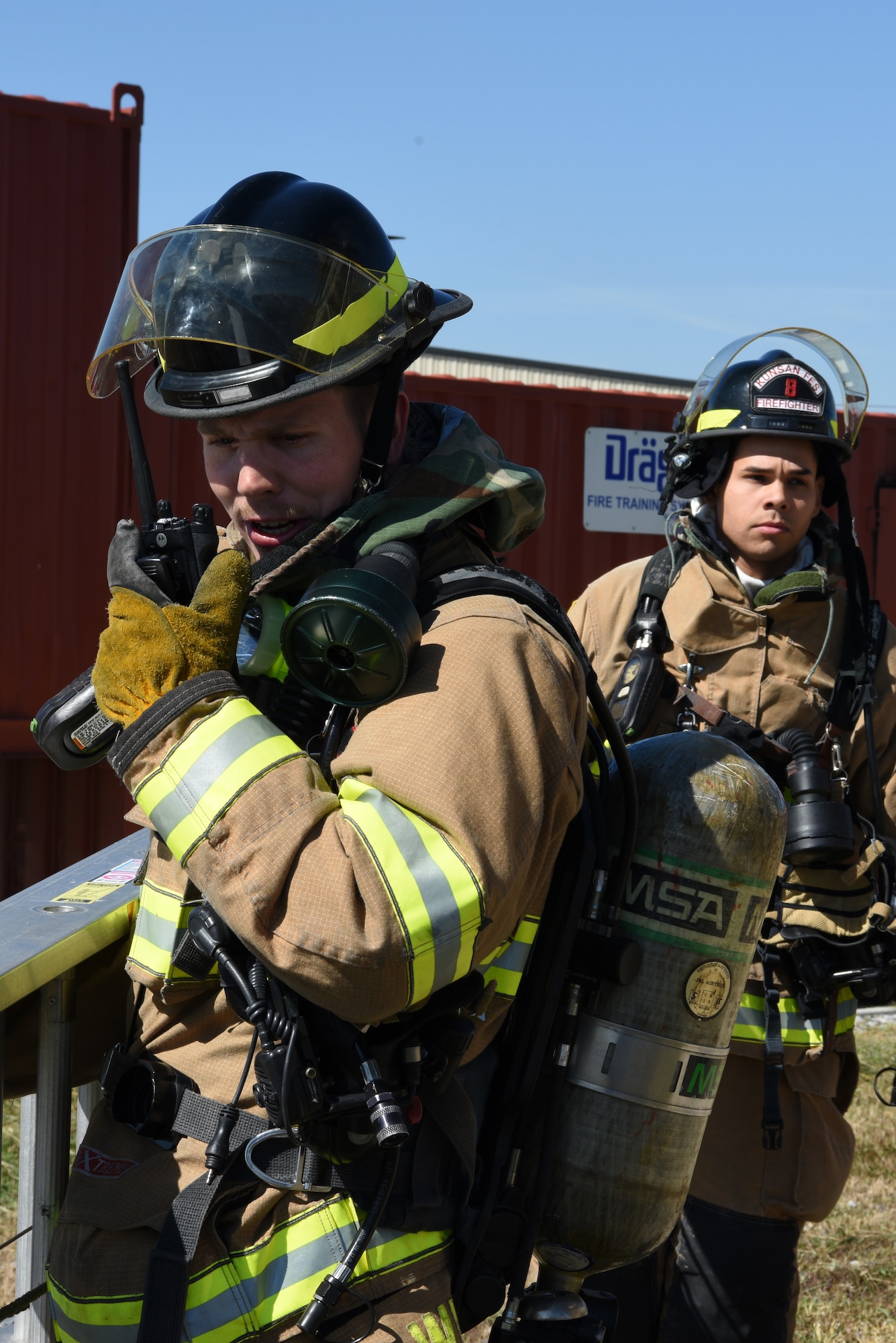 U.S. Air Force 8th Civil Engineer Squadron firefighters radio in about a fire during a training event at Kunsan Air Base, Republic of Korea, Oct. 9, 2019. The 8th CES firefighters train in multiple scenarios including plane incidents, car accidents and structure fires to be able to react to real world events. (U.S. Air Force photo by Staff Sgt. Joshua Edwards)
