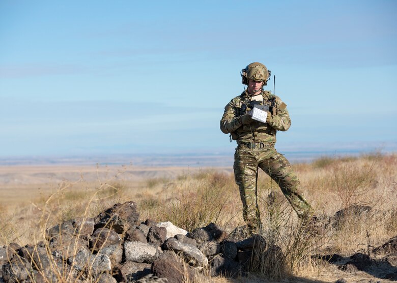 Airman reviews mission notes at the Saylor Creek Bombing Range