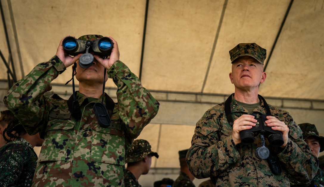 U.S. Marine Maj. Gen. Paul J. Rock Jr., right, and Japan Ground Self-Defense Force Maj. Gen. Shinichi Aoki observe an amphibious exercise during KAMANDAG 3 at Katungkulan Beach, Marine Barracks Gregorio Lim, Philippines, Oct. 12.