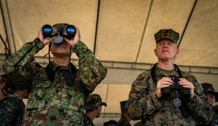 U.S. Marine Maj. Gen. Paul J. Rock Jr., right, and Japan Ground Self-Defense Force Maj. Gen. Shinichi Aoki observe an amphibious exercise during KAMANDAG 3 at Katungkulan Beach, Marine Barracks Gregorio Lim, Philippines, Oct. 12, 2019. KAMANDAG helps participating forces maintain a high level of readiness and responsiveness, and enhances combined military-to-military relations, interoperability, and multinational coordination. Rock Jr. is the commander of 3rd Marine Expeditionary Brigade and the deputy commander of III Marine Expeditionary Force. Aoki is the commander of the JGSDF Amphibious Rapid Deployment Brigade. KAMANDAG is an acronym for the Filipino phrase "Kaagapay Ng Mga Manirigma Ng Dagat," which translates to "Cooperation of the Warriors of the Sea," highlighting the partnership between the U.S. and Philippine militaries.