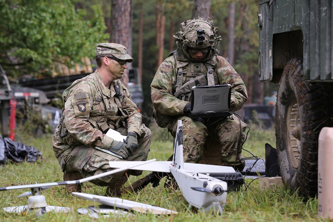 U.S. Soldiers patrol through their camp during Saber Junction 19