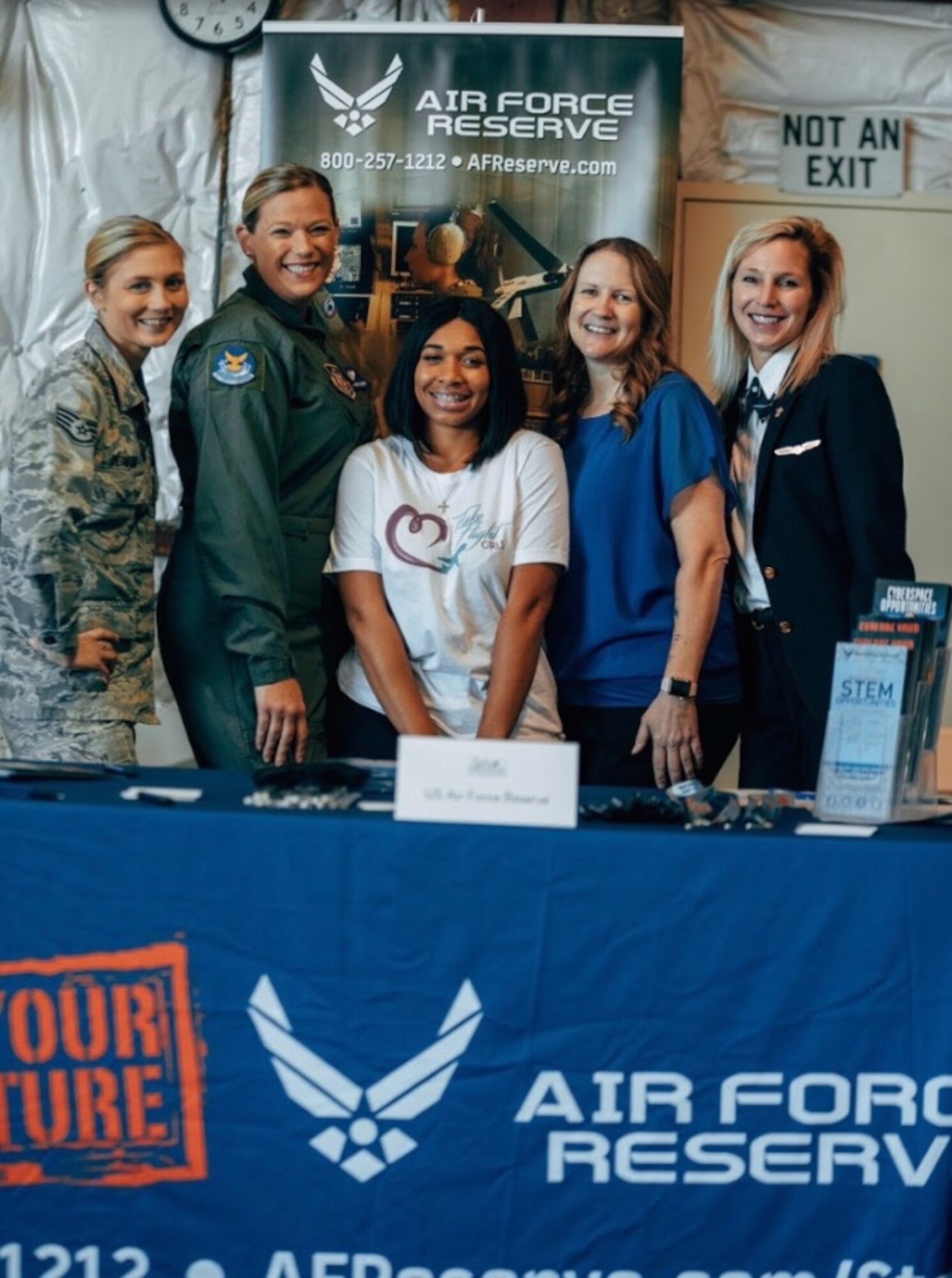 Several 932nd Airlift Wing members and alumni volunteered to speak to high school girls and teachers at the Girls in Aviation Day held Oct. 4, 2019 at the St. Louis Downtown Airport.  Staff Sgt. Jennifer Deimund, Tech Sgt. Stephanie Enders, Tech Sgt. Stephanie McCloud, Tech Sgt. April Tarbill and retired C-40 pilot Lt. Col. Tracy Vazanna helped answer questions about aviation, and their unique military experiences serving America in the Air Force Reserve's 932nd Airlift Wing, located at Scott Air Force Base.  The Illinois unit flies the C-40C distinguished visitor aircraft.  (Photo submitted)