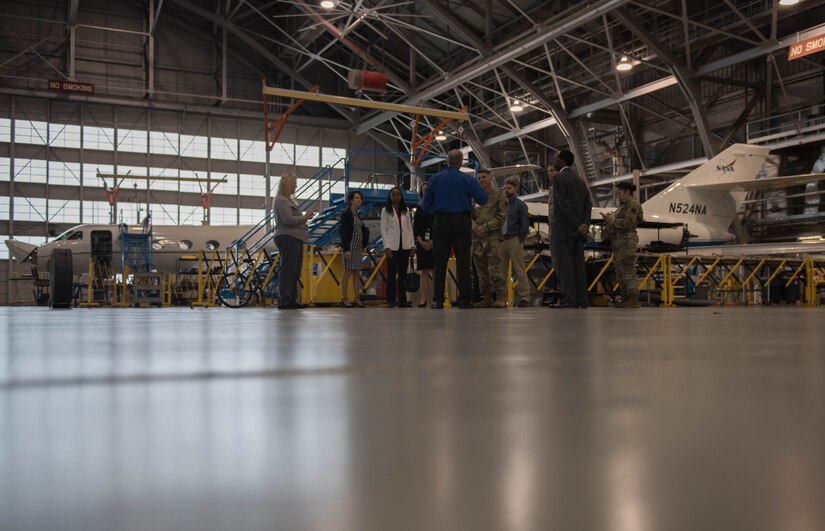 U.S. Air Force Col. Clinton Ross, 633rd Air Base Wing commander, and Chief Master Sgt. Gregory Peterson, 633rd Air Base Wing command chief, talk to personnel at the Langley Research Center in Hampton, Virginia, Oct. 9, 2019. Ross and Peterson, along with others, received a tour of the facilities at the LaRC which served as an indoctrination to NASA’s mission in the Hampton, Virginia community. (U.S. Air Force photo by Airman 1st Class Sarah Dowe)