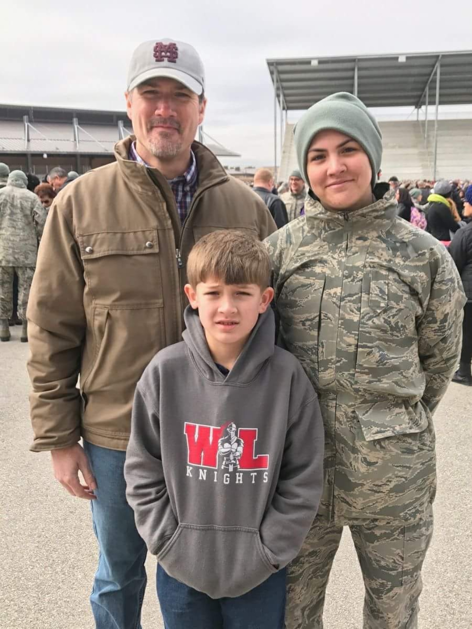 Airman 1st Class Kristen Pittman poses for a photo with her father, Jody Pittman, and her brother, Conner Pittman, after the Airman's coin ceremony at Joint Base San Antonio-Lackland, Texas Jan. 18, 2018. (Courtesy photo)